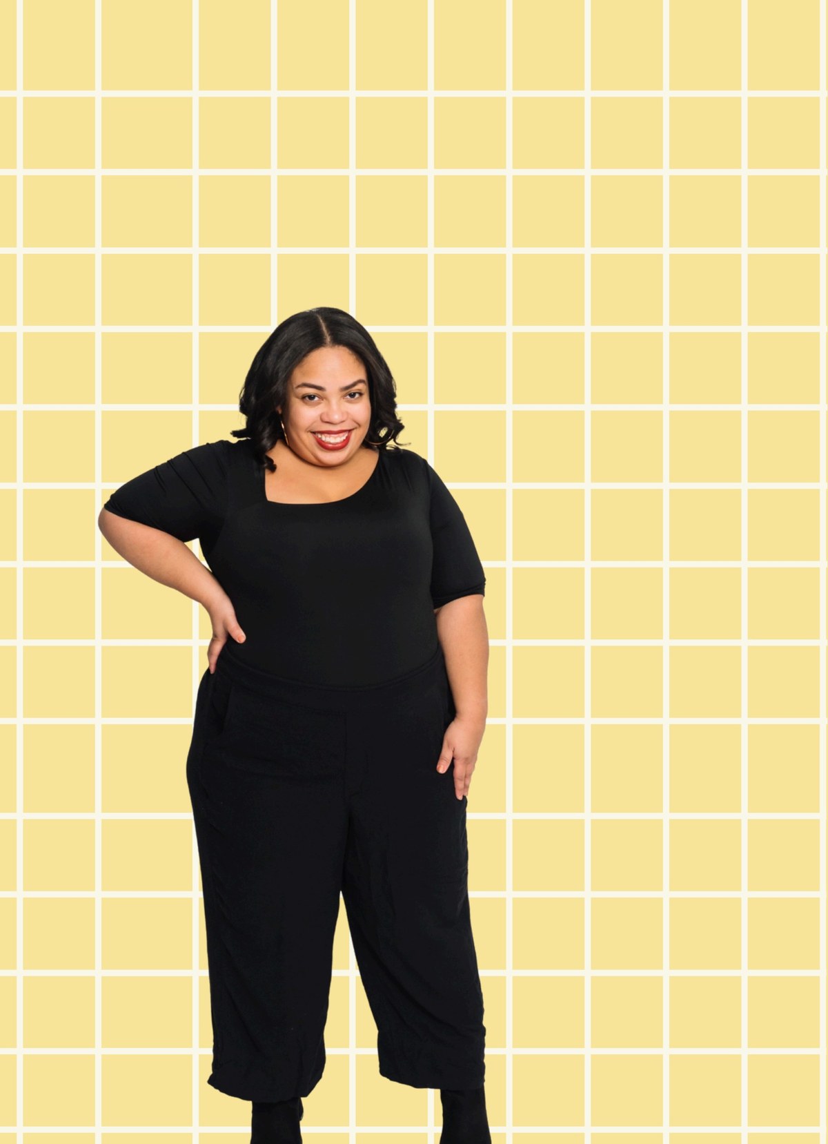 Natalie Madrigal standing against a yellow grid background